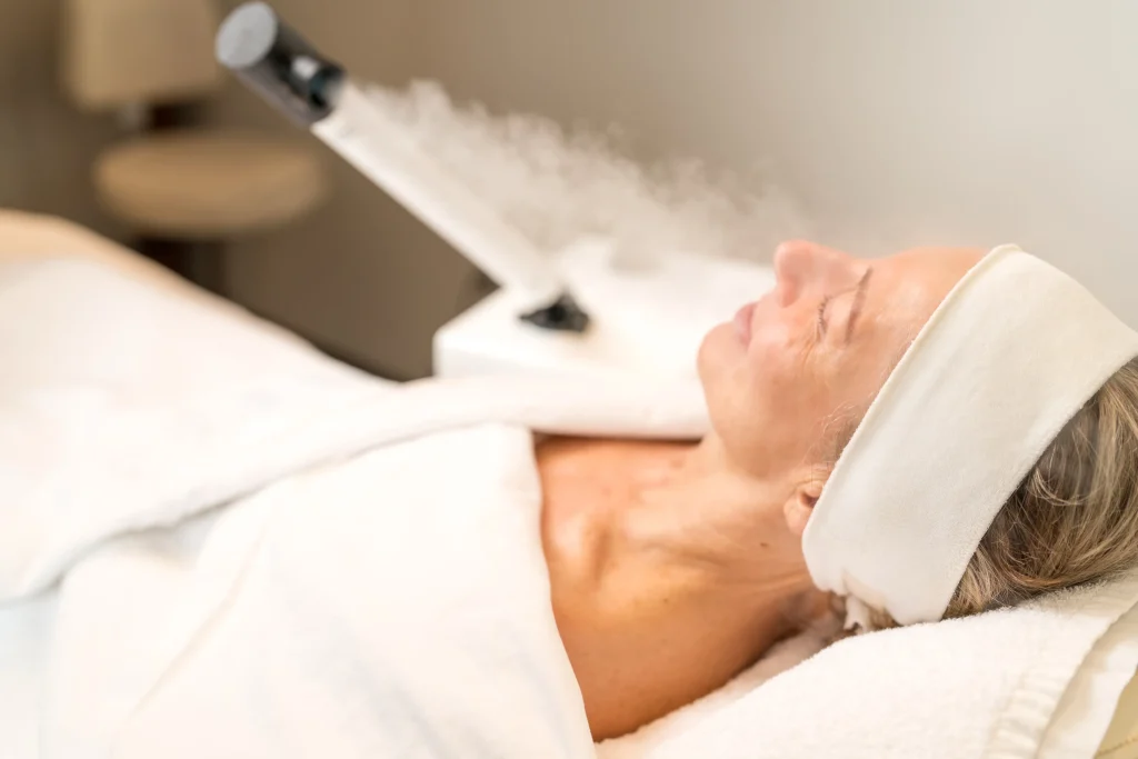 woman receiving a European facial treatment at PURE Esthetics Kelowna