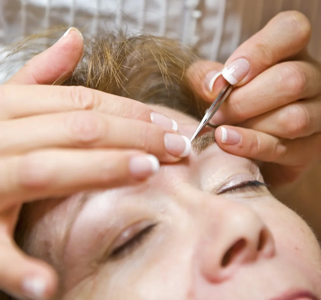 close up of eyebrow with marking for brow design