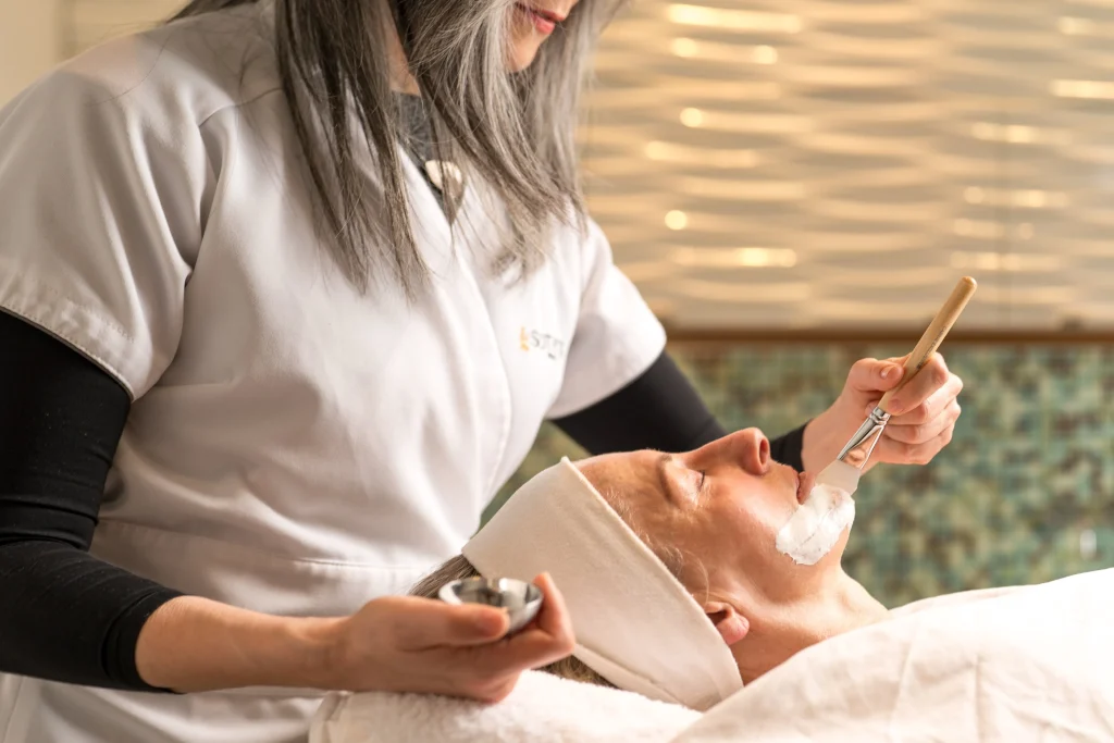 woman receiving a corrective facial treatment at PURE Esthetics Kelowna